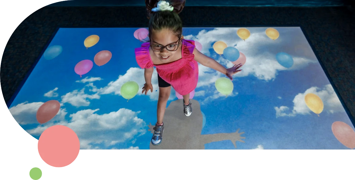 little girl dances in interactive exhibit