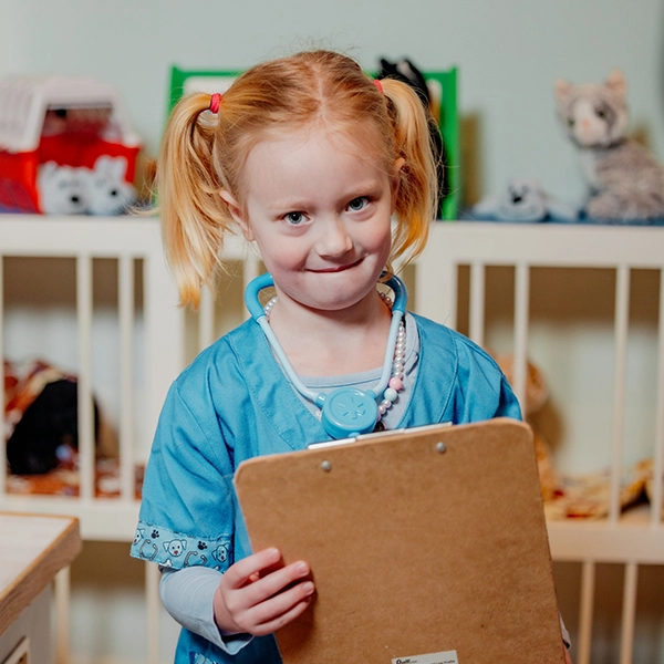 Young girl dressed as doctor