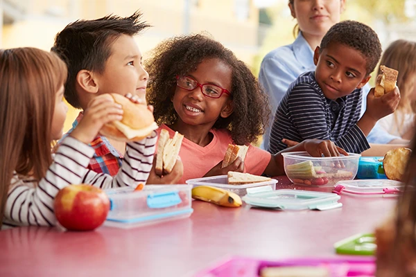 kids sitting at lunch table together