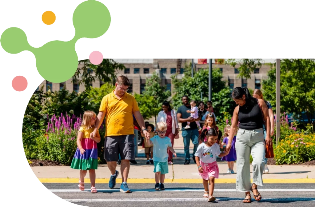 a group of families walking into the museum