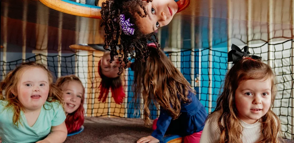 a collection of young girls play together